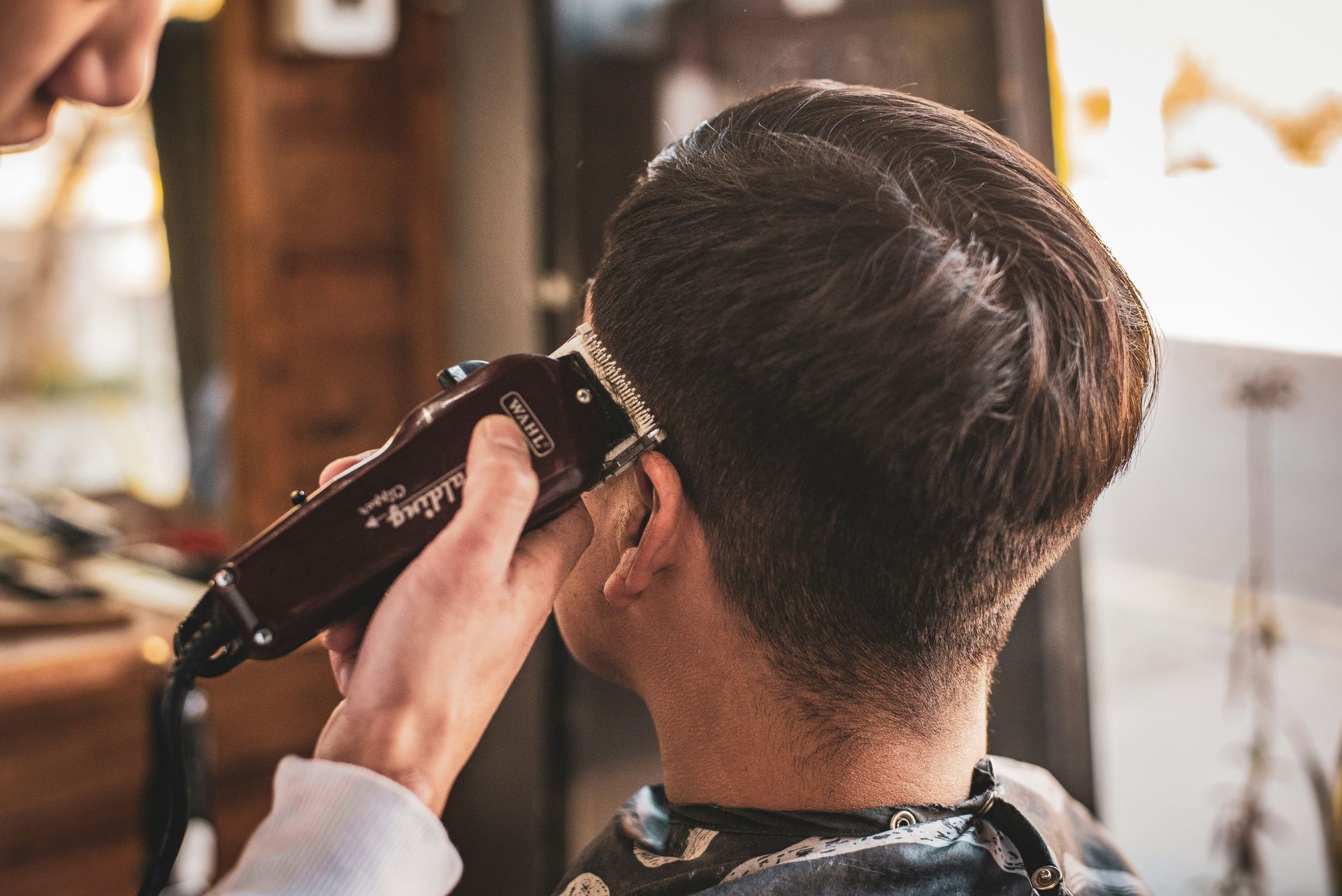 man in white dress shirt holding black dslr camera